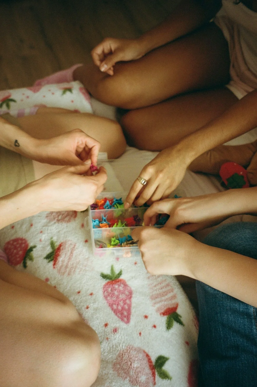A group of people sitting on top of a bed
